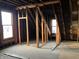 Attic under construction featuring exposed wood framing, ready for custom design at 802 S Anderson St, Elwood, IN 46036