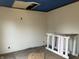 Bedroom showing repairs are needed, with blue ceiling, missing ceiling tile, and peeling paint at 802 S Anderson St, Elwood, IN 46036