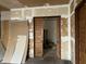 View of doorway with slider with unfinished drywall around frame and trim at 802 S Anderson St, Elwood, IN 46036