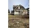 Street view of a multi-story home with peeling paint at 802 S Anderson St, Elwood, IN 46036