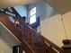 Stairway with decorative trim and a window, ready for restoration and upgrades at 802 S Anderson St, Elwood, IN 46036