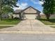 Charming brick home with an attached two car garage and a long driveway at 8054 Painted Pony Dr, Indianapolis, IN 46217