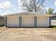 Spacious three-car garage with updated doors and ample parking space at 809 N Temple Ave, Indianapolis, IN 46201