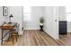 Home office space with desk, chair, neutral walls, and wood-look floors at 809 N Temple Ave, Indianapolis, IN 46201