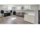 Finished basement features wood-look flooring, light grey walls, a comfortable couch, and ample space at 8103 Laughlin Dr, Indianapolis, IN 46219