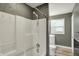 A full bathroom with a shower and sink at 8103 Laughlin Dr, Indianapolis, IN 46219