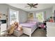 Cozy bedroom with two windows, soft carpet and a teddy bear at 8103 Laughlin Dr, Indianapolis, IN 46219