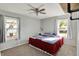 This bedroom features large windows and a ceiling fan at 8103 Laughlin Dr, Indianapolis, IN 46219