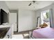Comfortable bedroom featuring a TV, soft carpet and lots of natural light at 8103 Laughlin Dr, Indianapolis, IN 46219