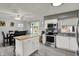 Open concept kitchen featuring an island with a butcher block top adjacent to a dining area at 8103 Laughlin Dr, Indianapolis, IN 46219