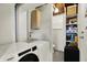 Bright laundry room features modern washer and dryer units with extra storage space at 8103 Laughlin Dr, Indianapolis, IN 46219