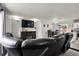 Spacious living area featuring a fireplace, entertainment center, and an open layout leading to a dining area and kitchen at 8103 Laughlin Dr, Indianapolis, IN 46219