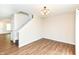 Dining room next to staircase shows open floor plan, hardwood floors and access to other living area at 8108 Amarillo Dr, Indianapolis, IN 46237