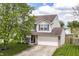 Attractive two-story home featuring a well-manicured lawn and a long driveway at 8108 Amarillo Dr, Indianapolis, IN 46237