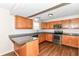Beautiful kitchen with stainless steel appliances, granite countertop, and wooden cabinets at 8108 Amarillo Dr, Indianapolis, IN 46237