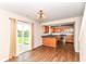 Dining room leading to kitchen with stainless steel appliances and wooden cabinets at 8108 Amarillo Dr, Indianapolis, IN 46237