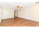 Spacious living room featuring hardwood floors, a ceiling fan, and access to other rooms at 8108 Amarillo Dr, Indianapolis, IN 46237