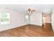 Well-lit living room with ceiling fan, hardwood floors, and windows for natural light at 8108 Amarillo Dr, Indianapolis, IN 46237