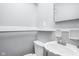 Compact half bathroom with white fixtures, perfect for guests at 818 Merry Ln, Greenwood, IN 46142