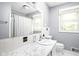 Cozy bathroom featuring a vanity and neutral walls with lots of natural light at 818 Merry Ln, Greenwood, IN 46142