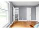 Spacious bedroom featuring hardwood floors and an open closet leading into a shared bathroom at 818 Merry Ln, Greenwood, IN 46142