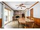 Dining area featuring a classic brick fireplace and sliding door to the back yard at 818 Merry Ln, Greenwood, IN 46142