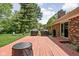 Patio features two grills, a fire pit and easy access to the home's sliding glass doors at 818 Merry Ln, Greenwood, IN 46142