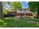 Lush backyard with patio and fire pit, perfect for outdoor entertaining and relaxation at 8227 Hoover Ln, Indianapolis, IN 46260