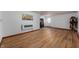 Spacious living room with hardwood floors, fireplace, and large windows providing ample natural light at 8227 Hoover Ln, Indianapolis, IN 46260