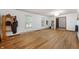 Bright living room featuring hardwood floors, windows, and equestrian equipment racks for countryside appeal at 8227 Hoover Ln, Indianapolis, IN 46260