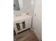 Stylish bathroom vanity with decorative mirrored cabinet, quartz countertop, and modern fixtures at 8627 Lansdowne Dr, Fishers, IN 46038