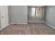 Bedroom features neutral walls, carpet, and natural light from a window at 8627 Lansdowne Dr, Fishers, IN 46038