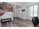 Bright foyer with wood staircase, grey floors and large window for natural light at 8627 Lansdowne Dr, Fishers, IN 46038