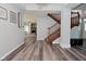 View from the entry area of the staircase, front entry and living room at 8627 Lansdowne Dr, Fishers, IN 46038
