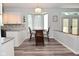 Charming breakfast nook features a bay window, modern lighting, and seamless flow to the kitchen area at 8627 Lansdowne Dr, Fishers, IN 46038