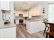 Well-lit white kitchen featuring modern appliances and granite countertops at 8627 Lansdowne Dr, Fishers, IN 46038