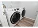 Bright laundry room featuring a modern, front-load washer and dryer set at 8627 Lansdowne Dr, Fishers, IN 46038