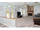 Inviting living room with a brick fireplace, ample natural light, and a seamless transition to the outdoors at 8627 Lansdowne Dr, Fishers, IN 46038