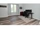 Office area has grey floors, decor, a large window for natural light, and desk at 8627 Lansdowne Dr, Fishers, IN 46038
