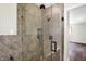 Modern shower with glass doors and updated fixtures in a tiled bathroom at 8834 W 1050 S, Fortville, IN 46040