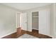 Bright bedroom with hardwood floors, a closet, and neutral color palette for a calming atmosphere at 8834 W 1050 S, Fortville, IN 46040