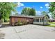 Back exterior view of home with a brick section and sunroom at 8834 W 1050 S, Fortville, IN 46040