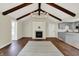 Living room with fireplace, exposed beams, and open concept design at 8834 W 1050 S, Fortville, IN 46040