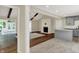 Open-concept living space with hardwood floors, fireplace, modern lighting, and abundant natural light at 8834 W 1050 S, Fortville, IN 46040