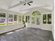 Bright sunroom with many windows and stylish ceiling fan at 8834 W 1050 S, Fortville, IN 46040
