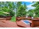 Multi-tiered deck featuring outdoor lounge area and dining with lush green surroundings at 9036 Buckeye Ct, Indianapolis, IN 46260