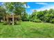 Large backyard with a treehouse and plenty of space for outdoor activities at 9036 Buckeye Ct, Indianapolis, IN 46260