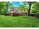 Large backyard and brick home with decks perfect for outdoor entertaining and gatherings at 9036 Buckeye Ct, Indianapolis, IN 46260