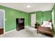 Bedroom features green walls, carpet, windows, furnishings, and a small bed at 9036 Buckeye Ct, Indianapolis, IN 46260
