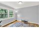 Light-filled bedroom with hardwood flooring, neutral paint, and a view of the backyard at 9036 Buckeye Ct, Indianapolis, IN 46260